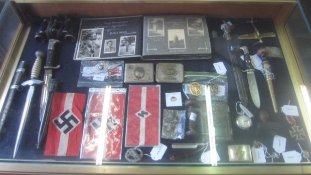 Symbols of hate: Part of a collection of Nazi memorabilia which was auctioned off in the ACT over the past two months.