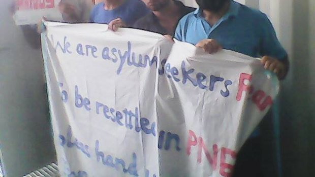 Asylum seekers at Manus Island stage a protest.