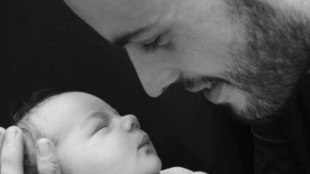 Mitch Finnerty with his newborn son, Cruz. 