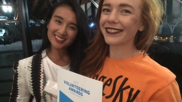 Orange Sky Laundry Canberra service manager Noreen Vu and volunteer Rebecca Butchart with the volunteering award won by the mobile laundry service for homeless people.