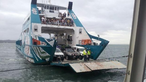 Stradbroke Ferries attempts to get passengers off its stranded Red Cat ferry.