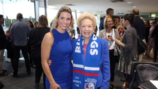 Susan Alberti, right, with ex-Matildas star Amy Duggan at an the AFL women's match earlier this year.