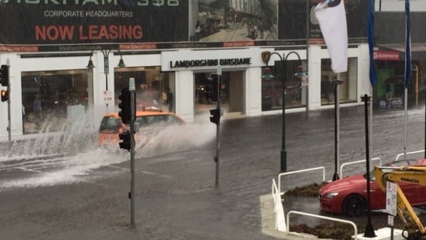 Motorists negotiate flash flooding at Fortitude Valley.