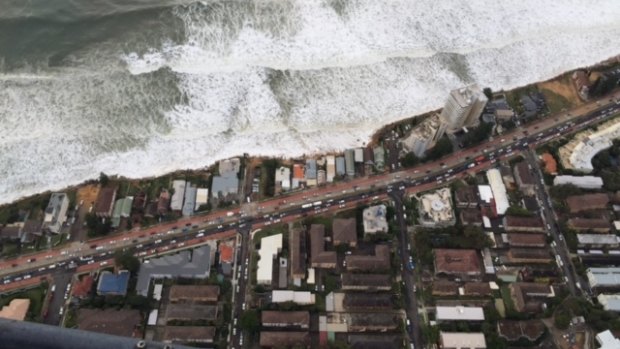 Water laps at properties on Sydney's coast.