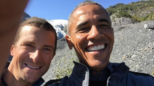 Barack Obama poses for a selfie with British wilderness adventurer Bear Grylls.