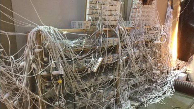 Police found a web of plug boards and extension leads.