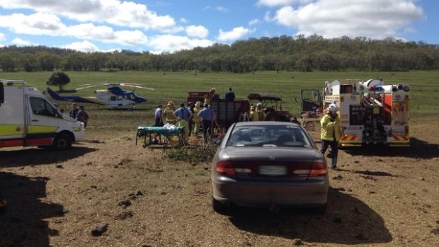 Paramedics attend a Nobby farm where a man's legs were caught in feeding equipment.