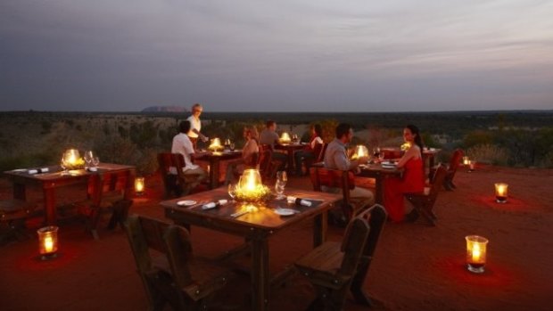 Tali Wiru is an intimate small group dining experience by candlelight atop a desert sand dune.