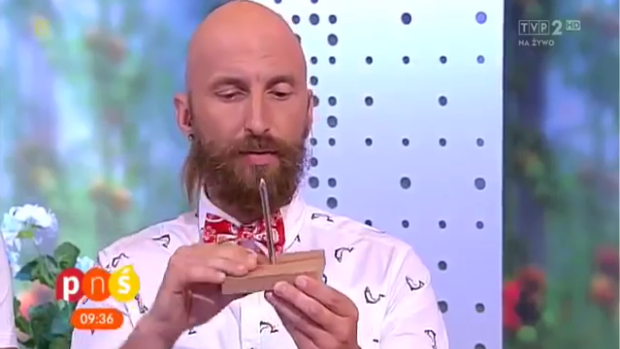 Truly sharp nail ... Magician Marcin Połoniewicz, a semi-finalist on <i>Poland's Got Talent</i>, shows the audience how sharp the nail is before the magic trick.  