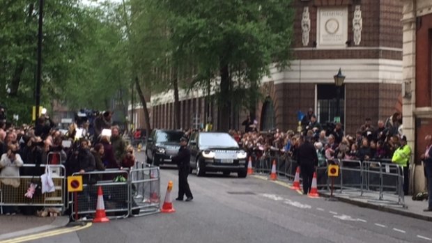 The royal convoy arrives to collect the new princess and her tired parents.