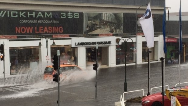 Motorists negotiate flash flooding at Fortitude Valley.