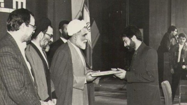 Kooshyar Karimi receives an award in Iran in 1994 for his achievements as a book translator. 