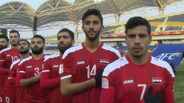 Ages queried: Syria line up for their opening game against the Olyroos in Kunshan.