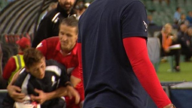 The incident: Michael Marrone grabs the ball boy during the FFA Cup final against Sydney FC.