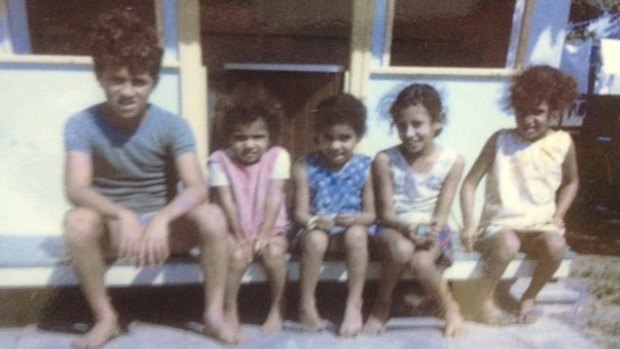 Sam Backo as a nine-year-old, pictured&nbsp;with his four sisters.