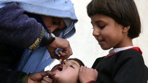 A child is vaccinated against polio in Afghanistan.