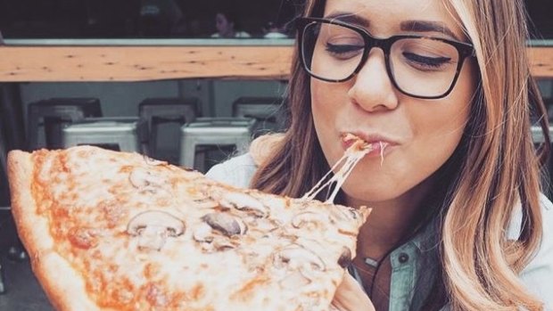 A social media account promoting photos of women eating junk food is becoming popular.