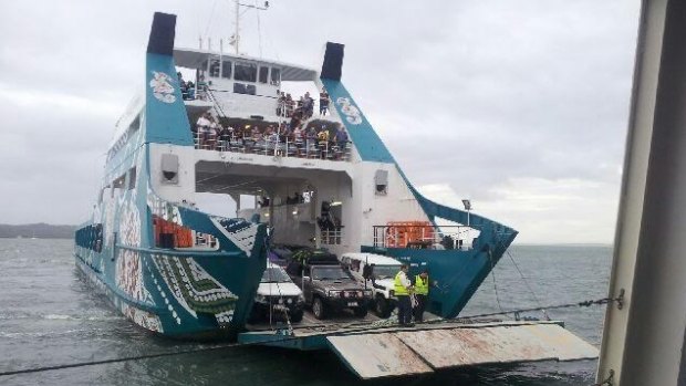Stradbroke Ferries attempts to get passengers off its stranded Red Cat ferry.