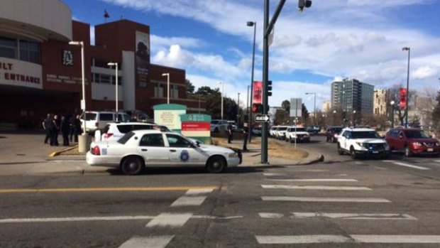 Authorities respond to the scene of a deadly shooting and stabbing at the National Western Complex, in Denver on Saturday.