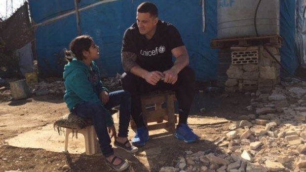 Man of the people: Sonny Bill Williams listens to Fatima's story.