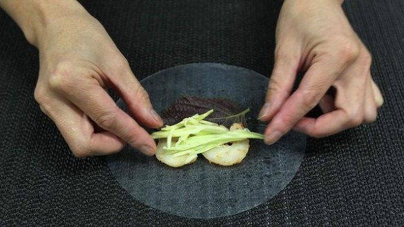 5. Place some green mango sticks on top of the prawns, then follow with a cucumber baton. 
