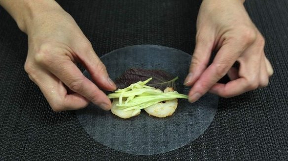 5. Place some green mango sticks on top of the prawns, then follow with a cucumber baton. 
