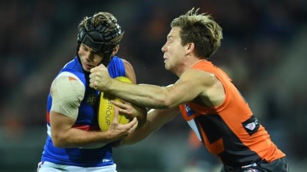 On the edge: Toby Greene accepted a two-match ban for this hit on Caleb Daniel.