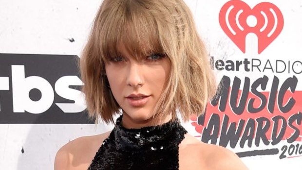 Taylor Swift picked up four prizes and gave a sweet shout-out to her "amazing" boyfriend, Calvin Harris.