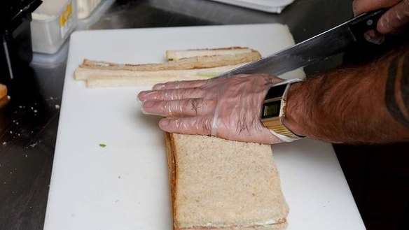 Step 12: Trim the four crusts using a serrated knife. 'Let the blade do the work for you,' Alderson says. 
