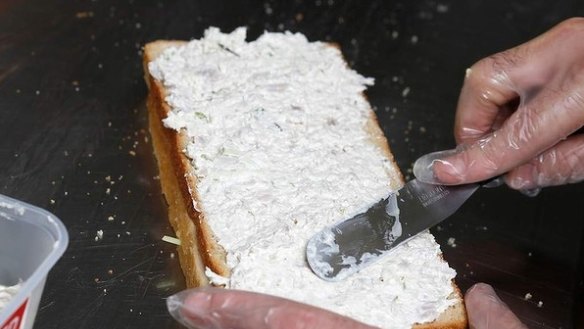Step 9: Spread the chicken mixture onto the bread. The ratio of bread to filling should be even. The filling should be spread right to the edges.
