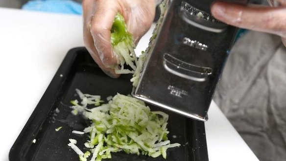 Step 4: Coarsely grate two Granny Smith apples. You don't need to pat dry the apples, as the juice helps to keep the sandwich fresh and moist. Leave the skin on the apples for texture. 
