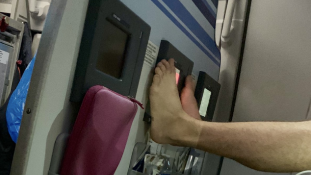 The passenger kept putting his feet back up on the screen, despite being repeatedly asked to put them down.