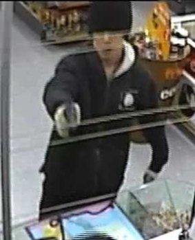 CCTV footage of a man wanted in relation to an armed robbery and an attempted armed robbery