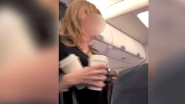 A video recorded by another passenger on the plane shows the woman shouting the N-word and other expletives at the flight attendant.
