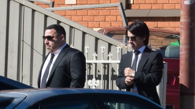 Michael Ibrahim, left, and his brother Fadi attend the funeral of Wally Ahmad in 2016.