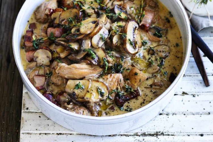 Chicken braised with mushrooms and thyme.  