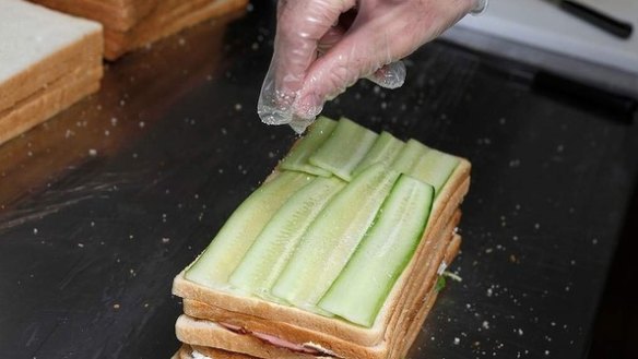 Step 10: Layer the alternating sandwich fillings in a stack. If using cucumber, be sure to pat it dry with paper towel to avoid a soggy sandwich.