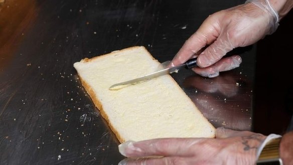 Step 8: Lightly (and gently) butter the bread slices using a metal spatula, being careful not to tear the bread. 