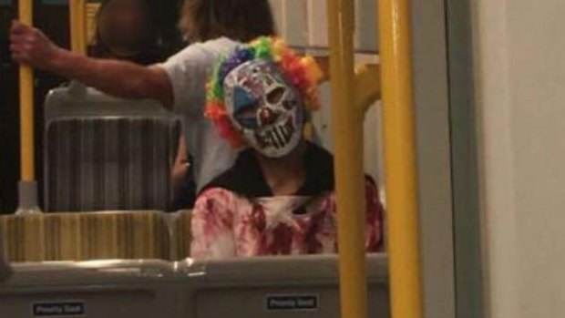 A clown photographed on public transport in Surfers Paradise. 