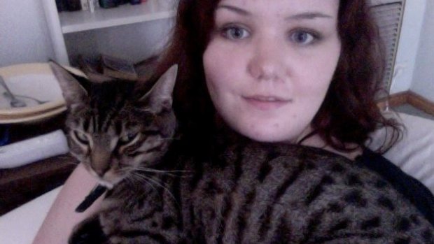 Jordaine Moat with her cat Basil who was shot through the eye with an arrow.