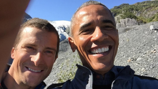 Barack Obama poses for a selfie with British wilderness adventurer Bear Grylls.