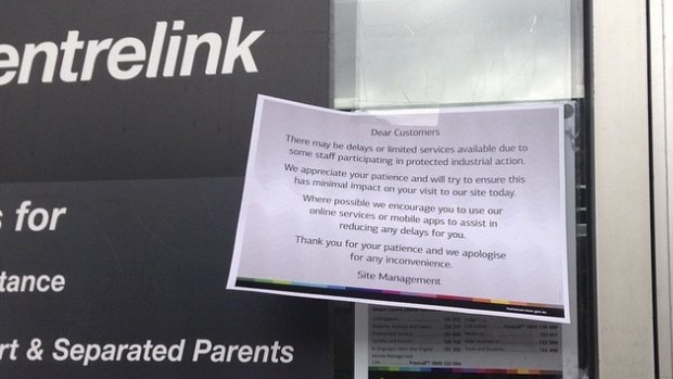 A sign warns customers of strike action at a Centrelink office.