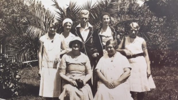 Rita Smith (standing, second from right) and other swimmers on tour with chaperones.