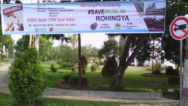 A banner makes it clear Tamiang welcomes Rohingya Muslims.