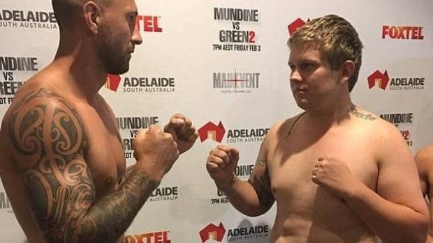 Quade Cooper with opponent Jack McInnes at Thursday's weigh-in.