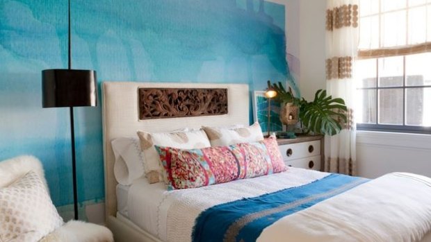 Nod off to sleep dreaming of the sea with wall art reminiscent of waves. 