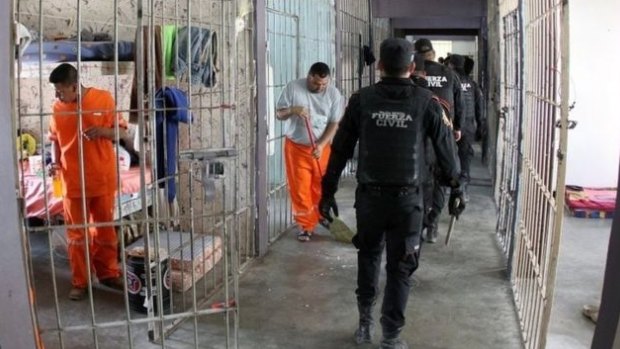 Police search a cell block at the Topo Chico prison in Monterrey, Mexico, after the riots.