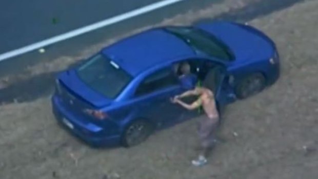 Police release footage of the moment a 154 km car chase ends with the gunmen sprinting towards oncoming traffic with one man firing at a passing car.