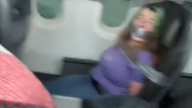 An unruly plane passenger on an American Airlines plane was duct-taped to seat.