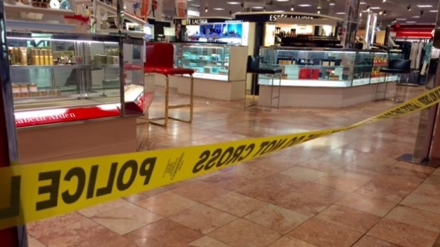 Crime scene tape is seen inside Macy's at the Silver City Galleria mall in Taunton on Tuesday.